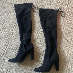 Tall black boots over the knee